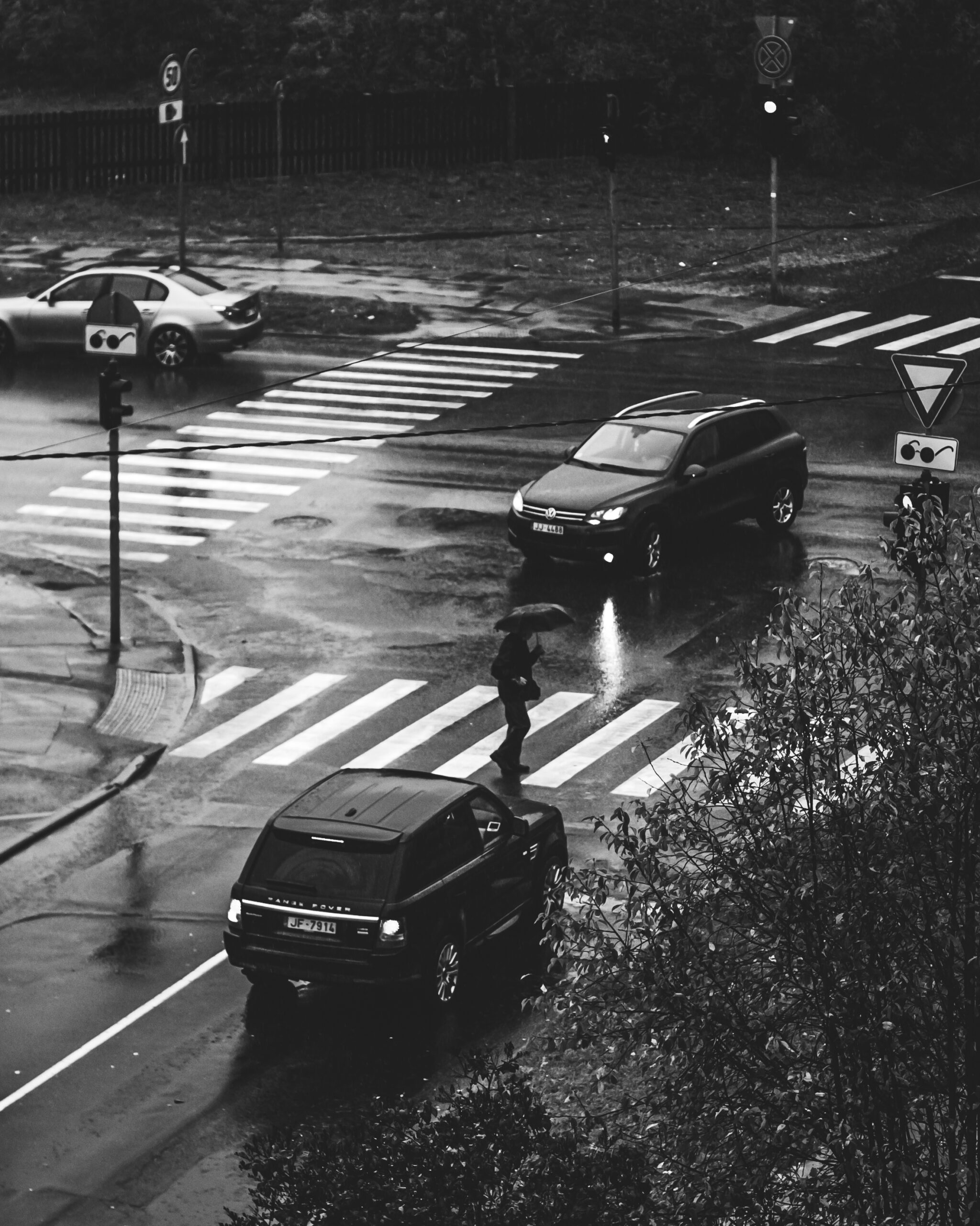 Cars on the street on a rainy day.